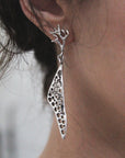 Aretes Volver